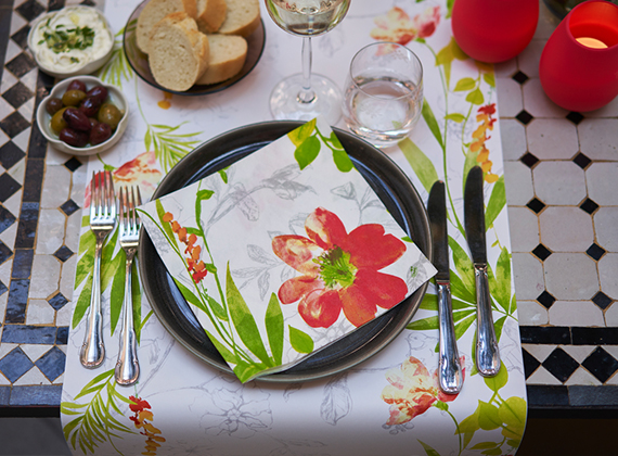 Colourful tropical design napkin on a matching table runner