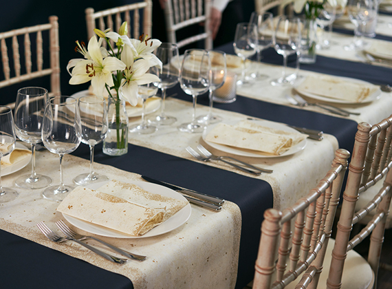 Festive themed banquet table with napkins and table runners