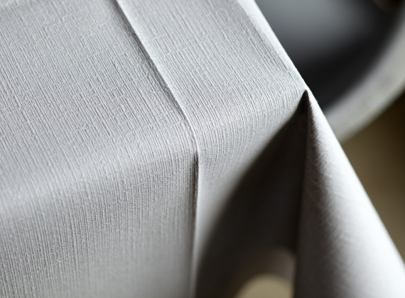A grey table cover in Evolin material